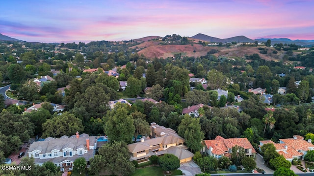 aerial view at dusk with a mountain view