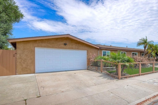 ranch-style home featuring a garage