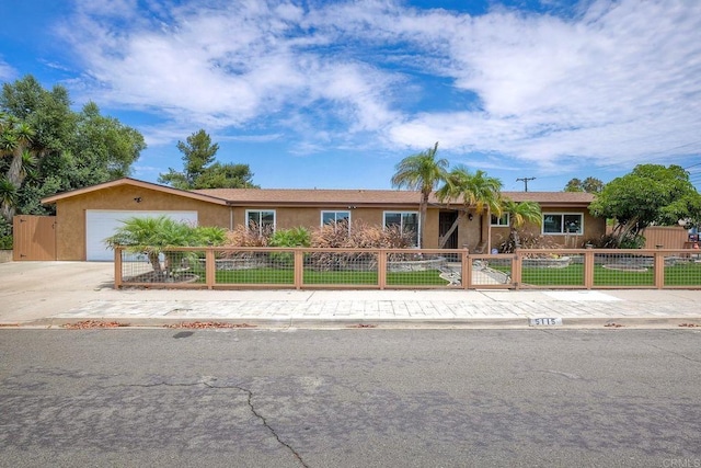 ranch-style house featuring a garage