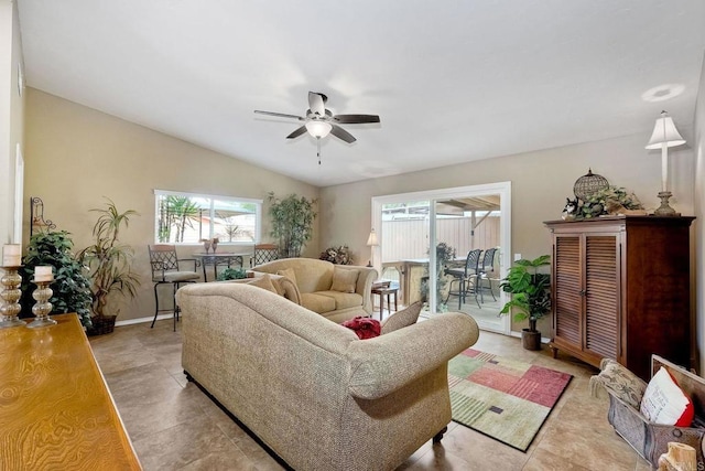 living room featuring vaulted ceiling and ceiling fan