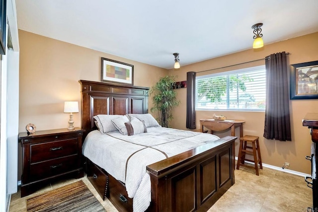 bedroom featuring light tile patterned floors