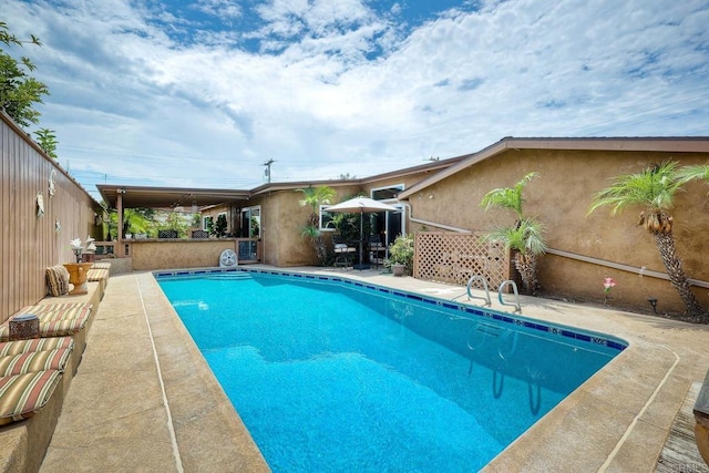 view of swimming pool with a patio