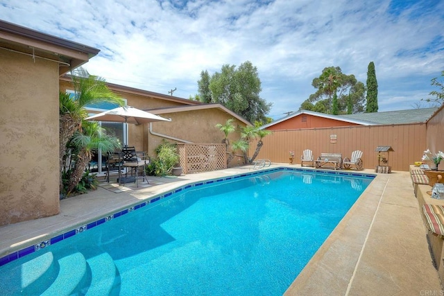 view of pool featuring a patio