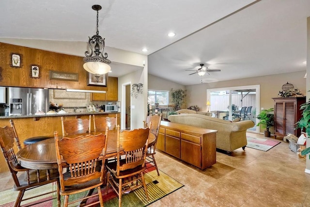 dining room featuring ceiling fan and vaulted ceiling