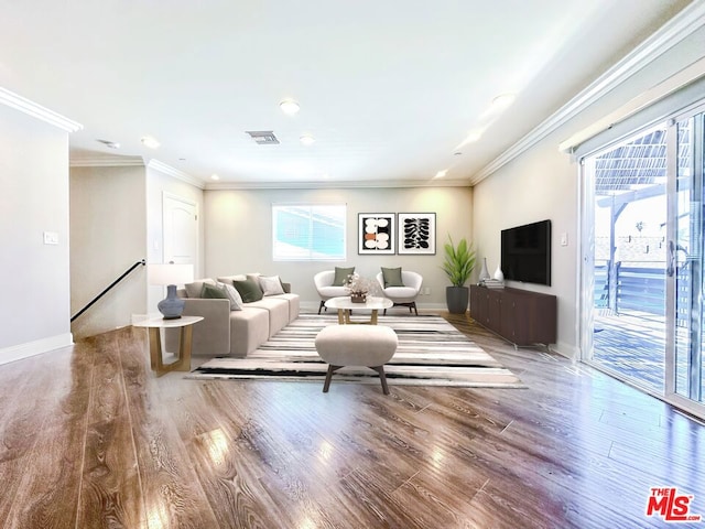 living room featuring ornamental molding and hardwood / wood-style floors