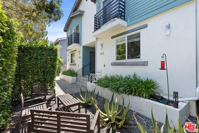 property entrance with a patio