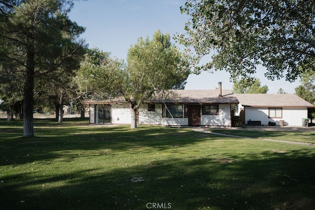 ranch-style home with a front lawn