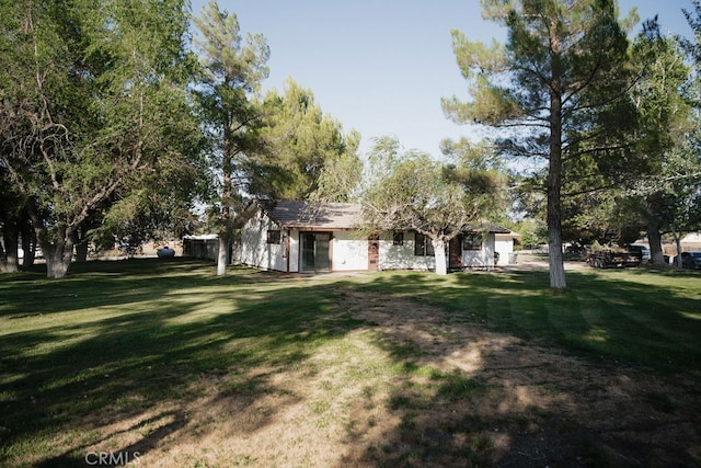 exterior space with a front lawn