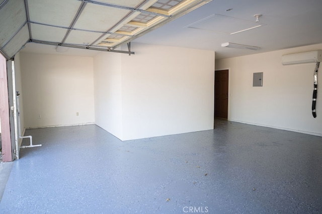 garage featuring an AC wall unit and electric panel