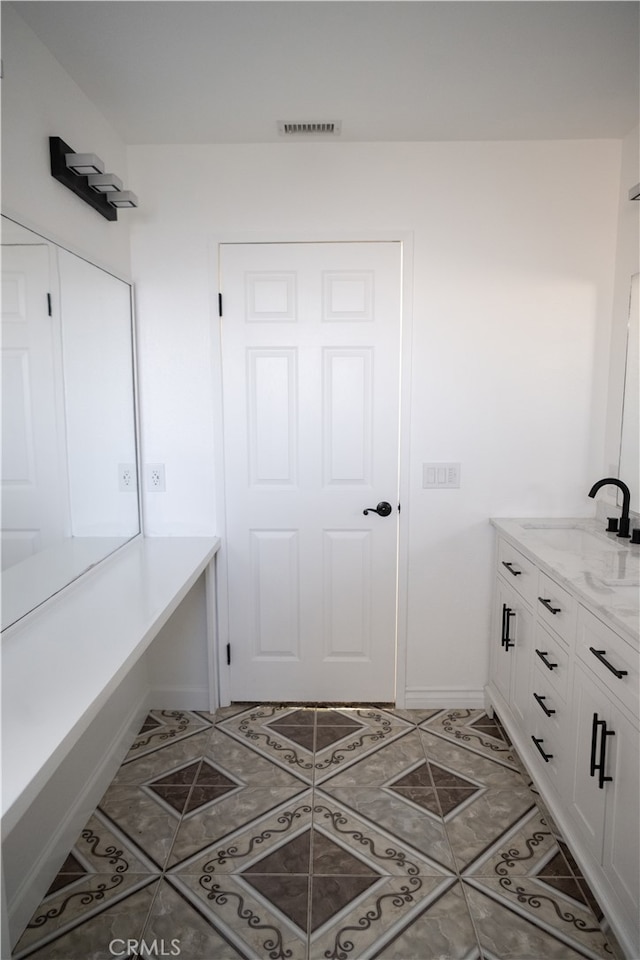 interior space with tile patterned flooring and vanity