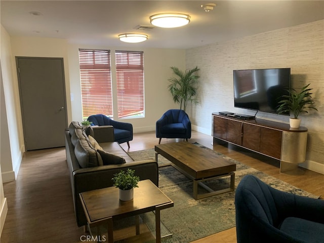 living room with dark hardwood / wood-style flooring