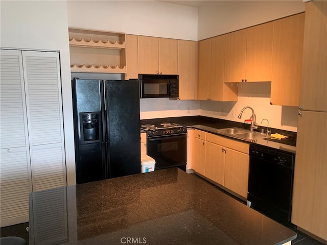 kitchen featuring black appliances, light brown cabinets, and sink