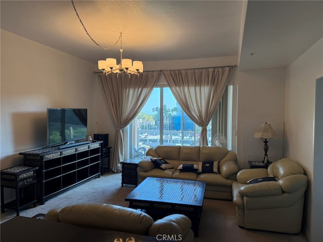 living room featuring an inviting chandelier and carpet floors