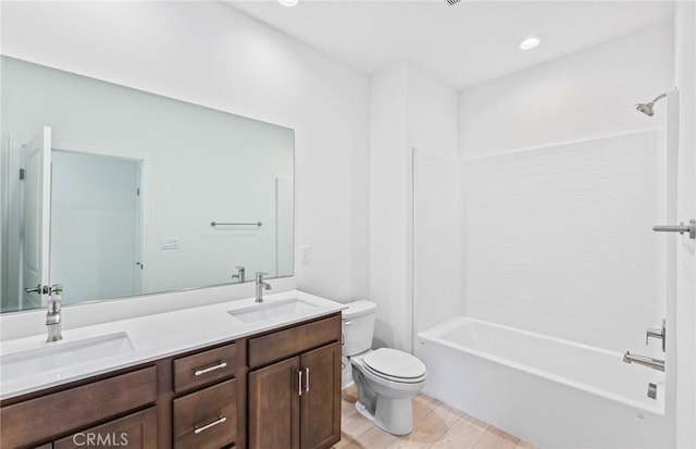 full bath featuring double vanity, wood finished floors, a sink, and toilet