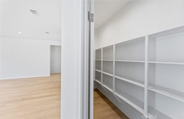 interior space featuring visible vents and wood finished floors