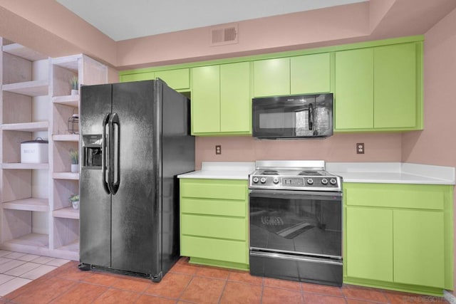 kitchen featuring black appliances and green cabinetry