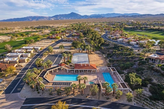 birds eye view of property featuring a mountain view