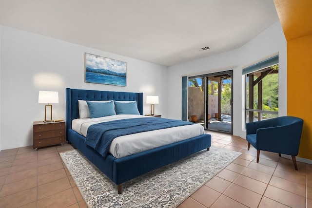 bedroom featuring access to exterior and tile patterned floors