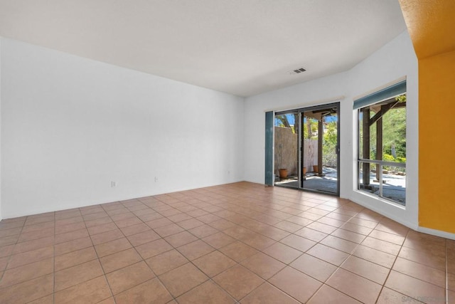 unfurnished room with light tile patterned floors