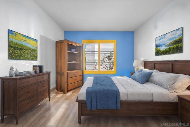 bedroom with light hardwood / wood-style flooring