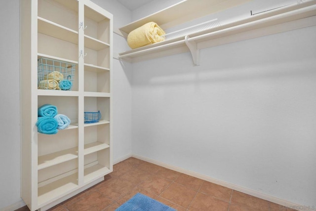 walk in closet featuring tile patterned floors