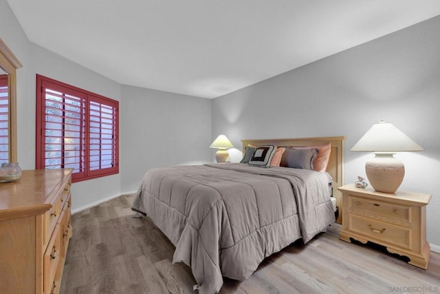 bedroom with light hardwood / wood-style flooring