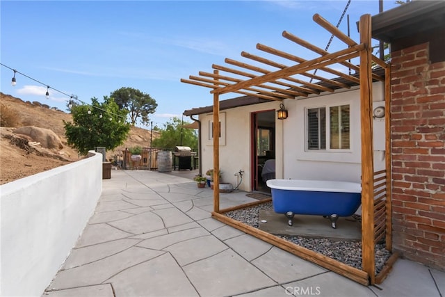 view of patio / terrace featuring a pergola