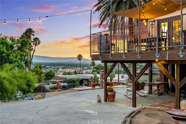 exterior space with a mountain view and a patio