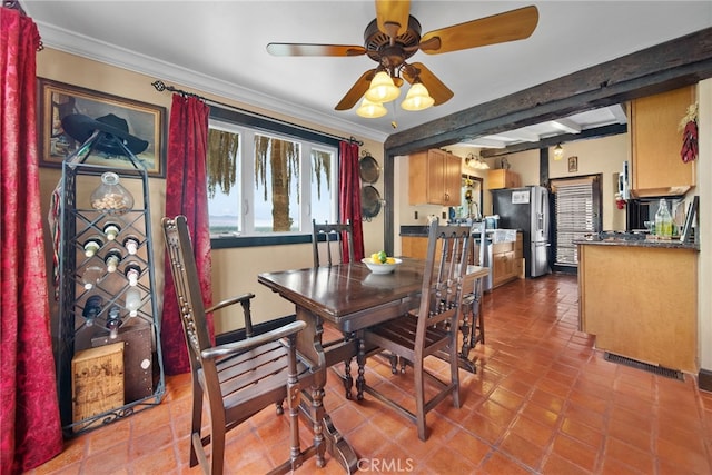 dining area featuring beam ceiling, ceiling fan, light tile patterned flooring, and ornamental molding