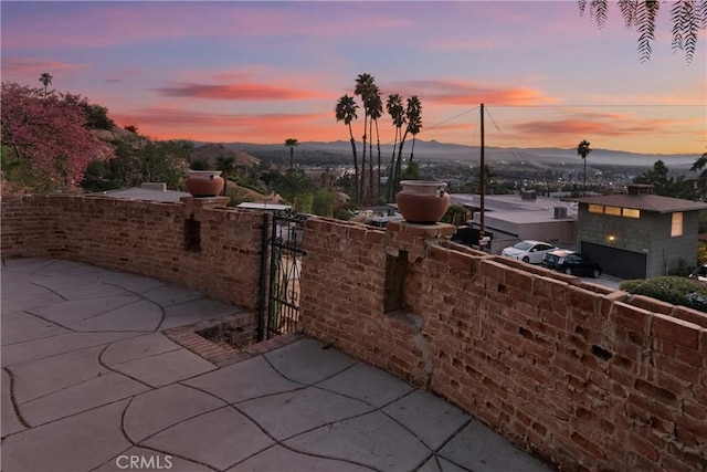 patio terrace at dusk with a mountain view