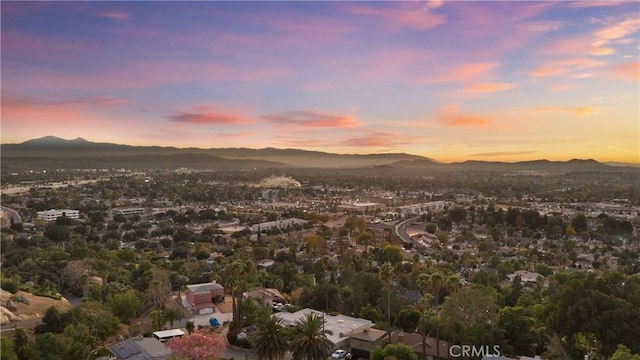 aerial view at dusk with a mountain view