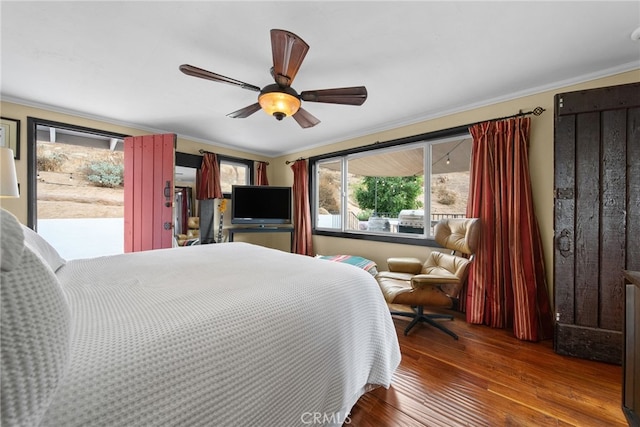 bedroom featuring ceiling fan, access to exterior, hardwood / wood-style flooring, and crown molding