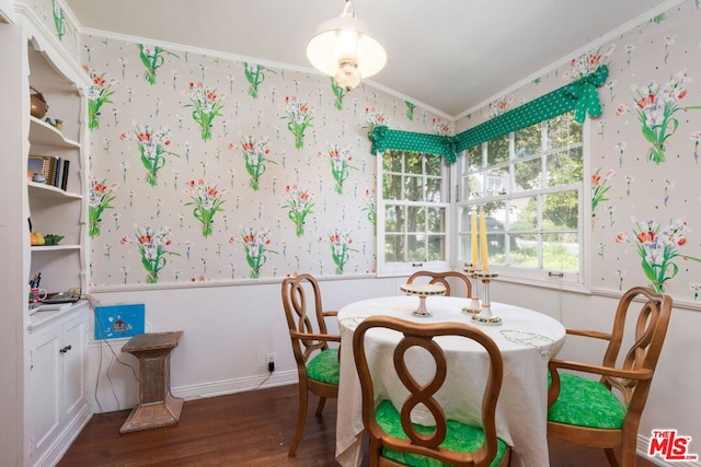 dining area with crown molding, lofted ceiling, and dark wood-type flooring