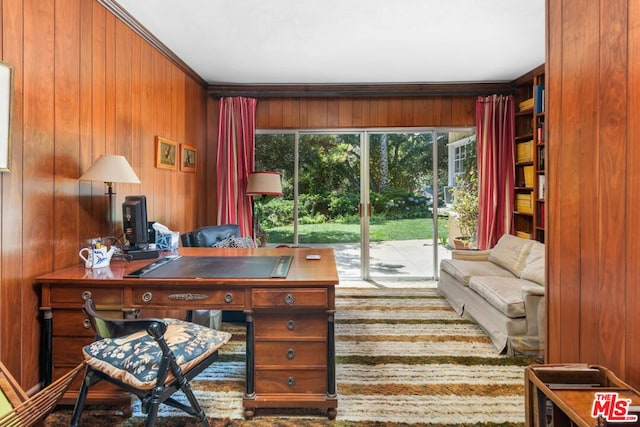 office space with wood walls and crown molding