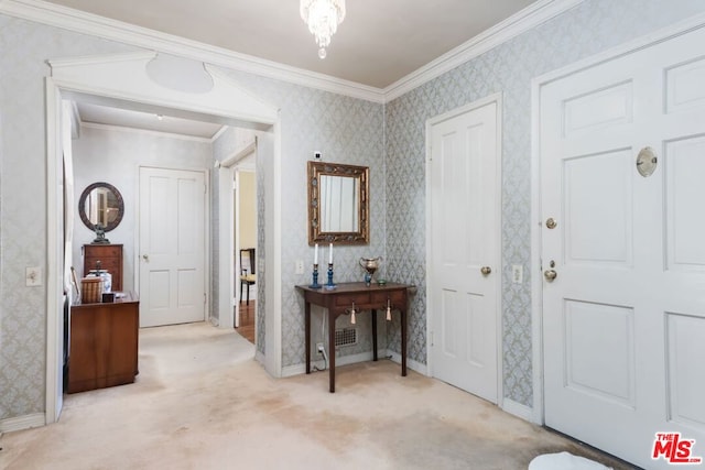 foyer featuring crown molding and light carpet