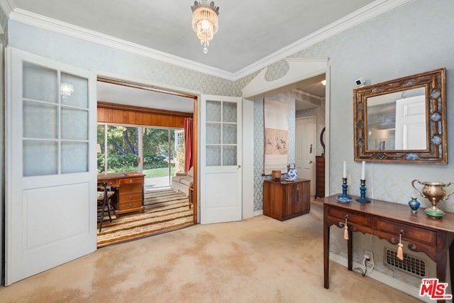 entryway featuring carpet floors and ornamental molding