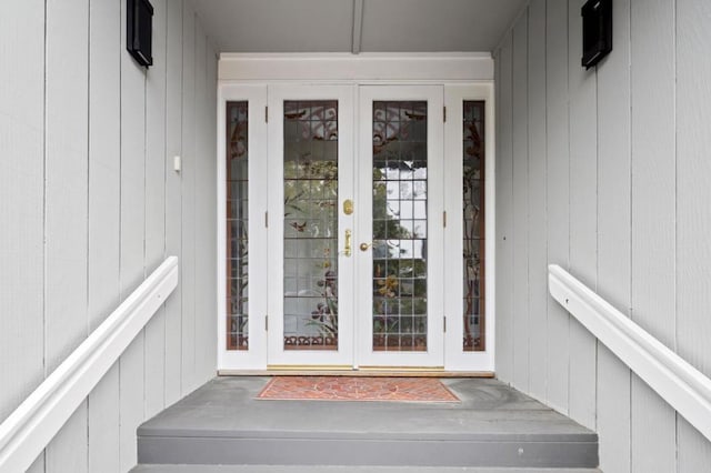 view of exterior entry featuring french doors