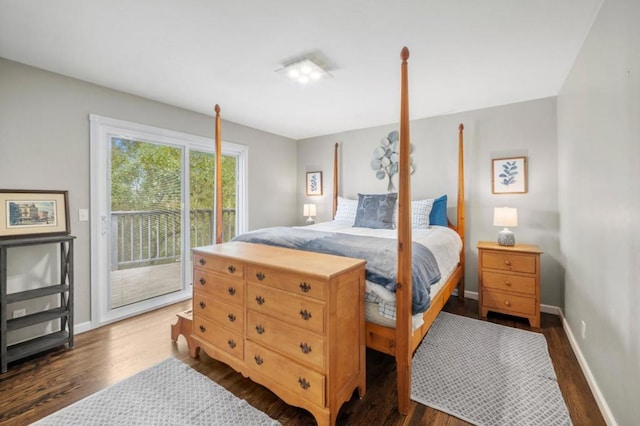 bedroom featuring access to exterior and dark hardwood / wood-style flooring