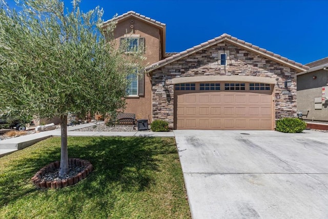 view of front of home with a garage and a front yard