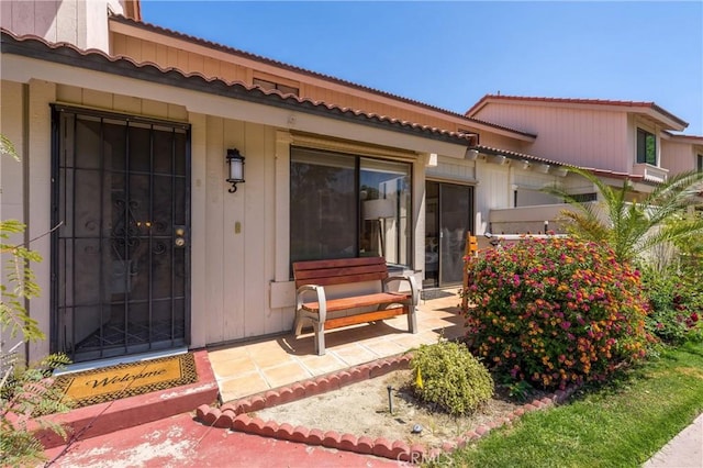 doorway to property with a patio