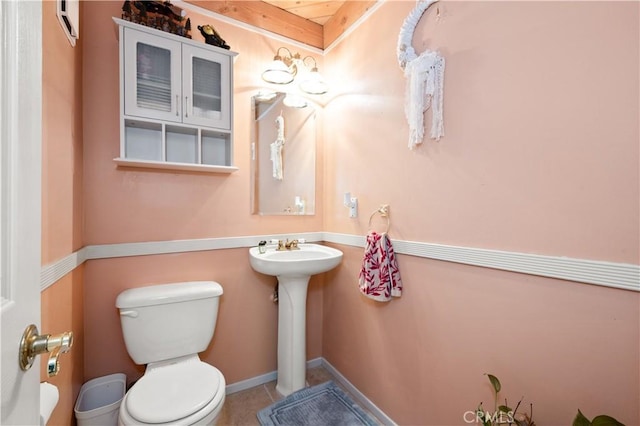 bathroom featuring tile patterned flooring and toilet