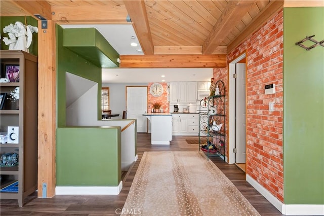 kitchen featuring dark wood-type flooring, white cabinets, decorative backsplash, beamed ceiling, and wood ceiling