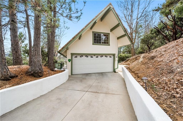 view of side of property with a garage