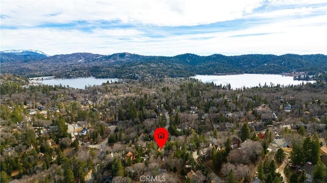 aerial view featuring a water and mountain view