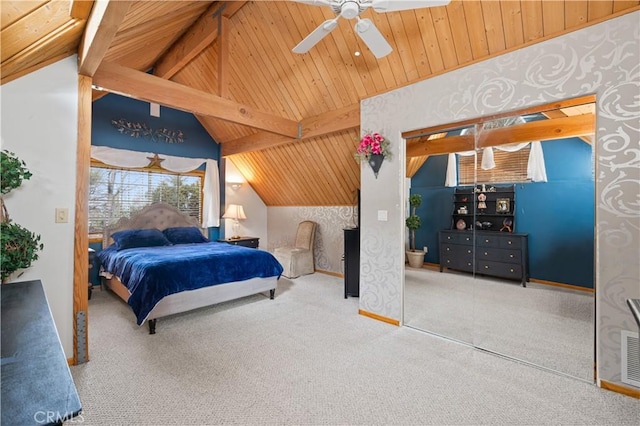 bedroom with carpet flooring, ceiling fan, lofted ceiling with beams, a closet, and wood ceiling