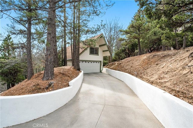 view of side of home featuring a garage