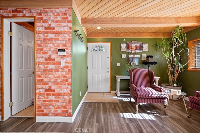 foyer with beamed ceiling and hardwood / wood-style flooring