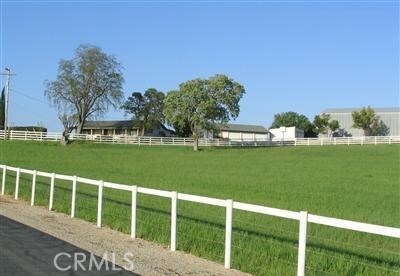 view of yard with a rural view