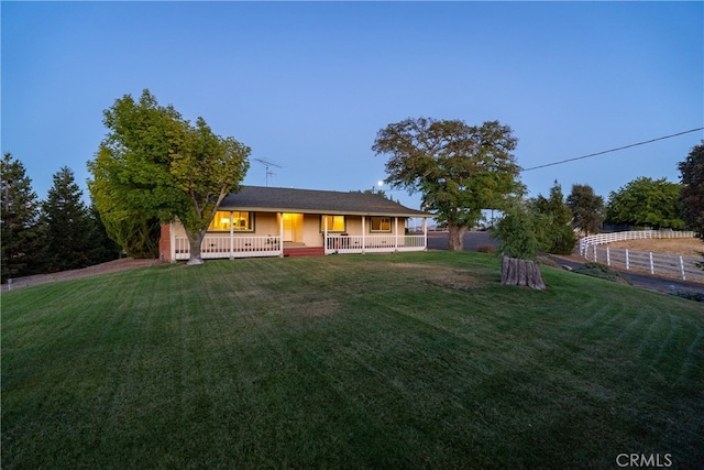 view of front of house featuring a front lawn and a porch