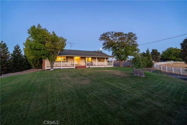 view of front of home featuring a front lawn and covered porch